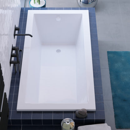 Drop-in white rectangular bathtub 60x30 inch with reversible drain and flat rim.