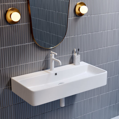 36" rectangular wall-mount bathroom sink in white ceramic with single faucet hole and integrated overflow drain.