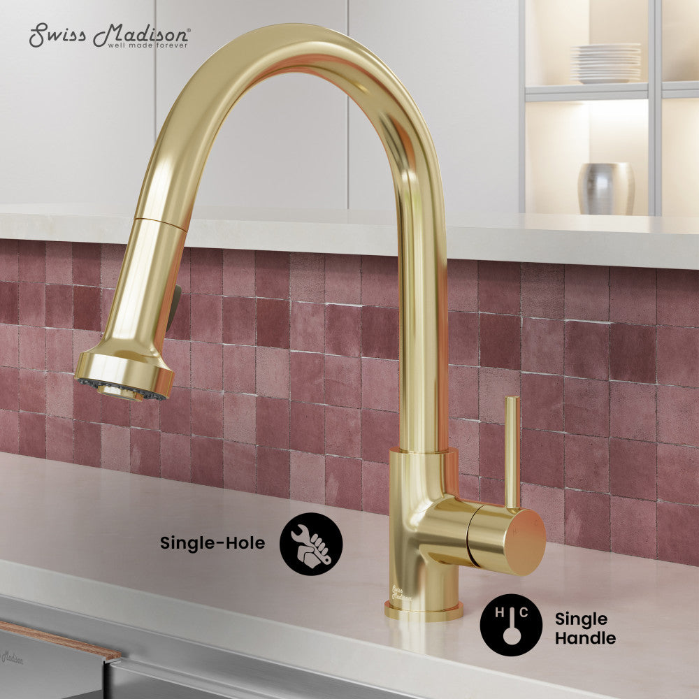Single-handle pull-down kitchen faucet in brushed gold with curved spout and lever handle.