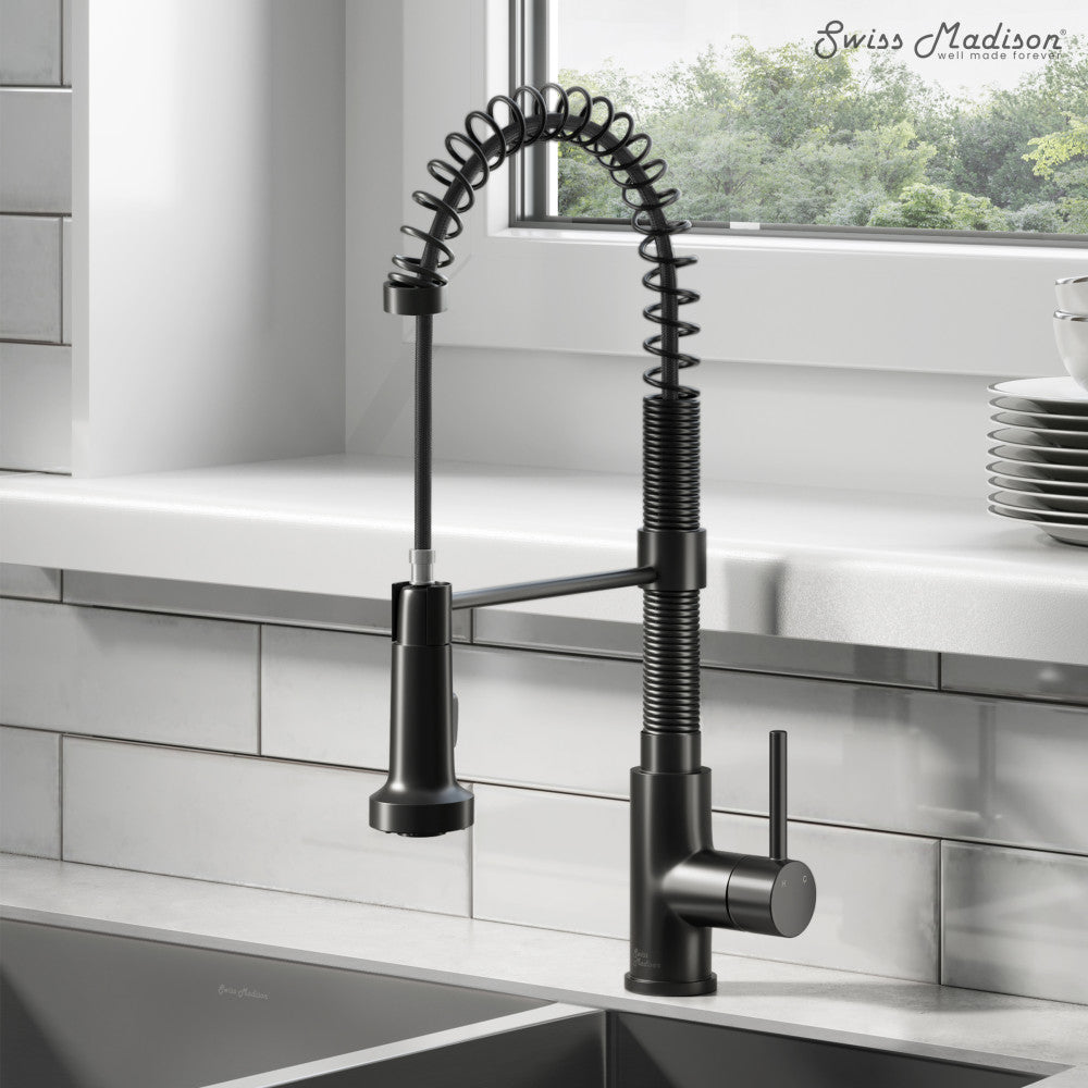 Single-handle pull-down kitchen faucet in matte black with spring coil design and curved spout.