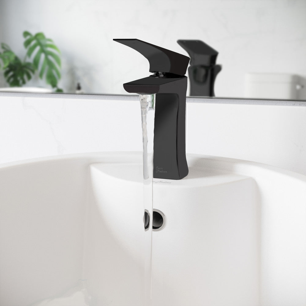 Single-handle bathroom faucet in matte black with sleek, modern angular design and water flowing from spout.