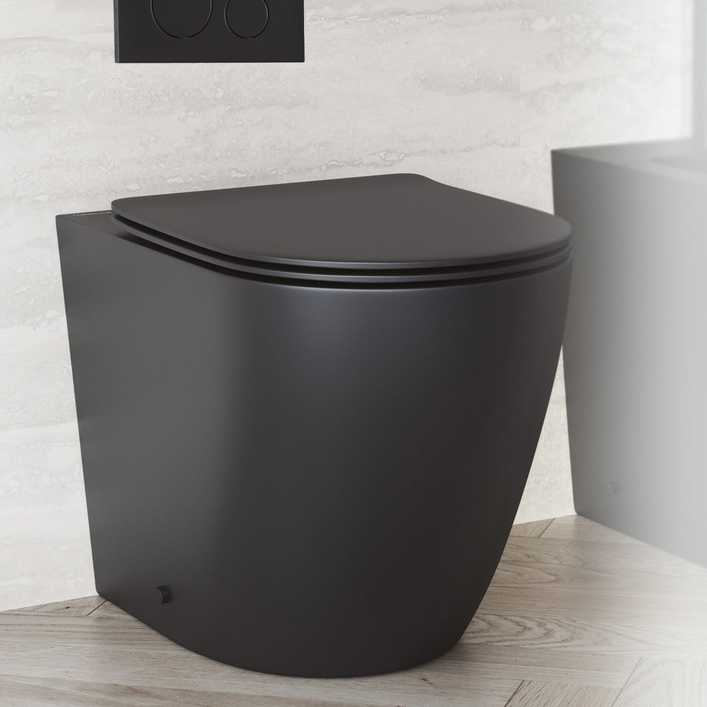 Elongated back-to-wall toilet bowl in matte black with soft-close seat and concealed trapway.