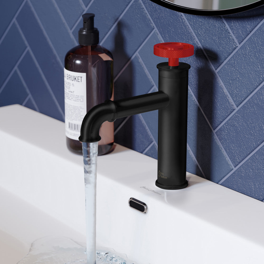 Single-handle bathroom faucet in matte black with distinctive red handle and curved spout.