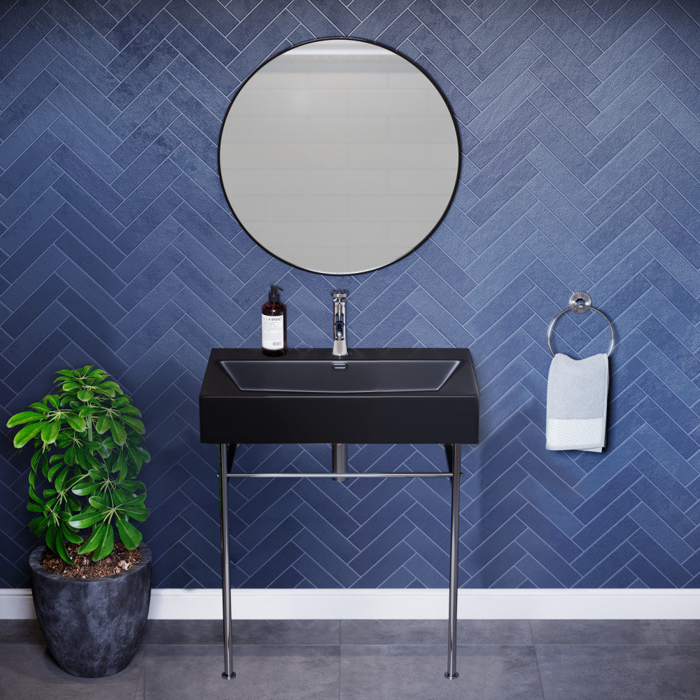 Matte black ceramic console sink with chrome legs, rectangular basin, wall-mounted design.
