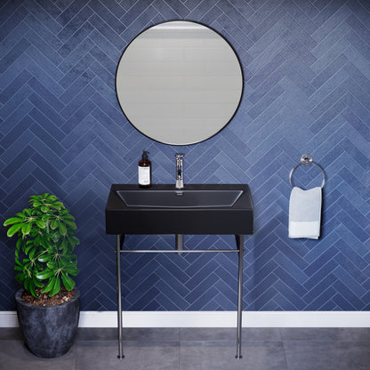 Matte black ceramic console sink with chrome legs, rectangular basin, wall-mounted design.