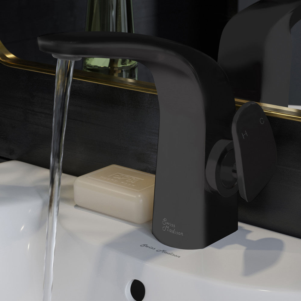 Single-handle bathroom faucet in matte black with curved spout, water flowing, and lever handle on the right side.