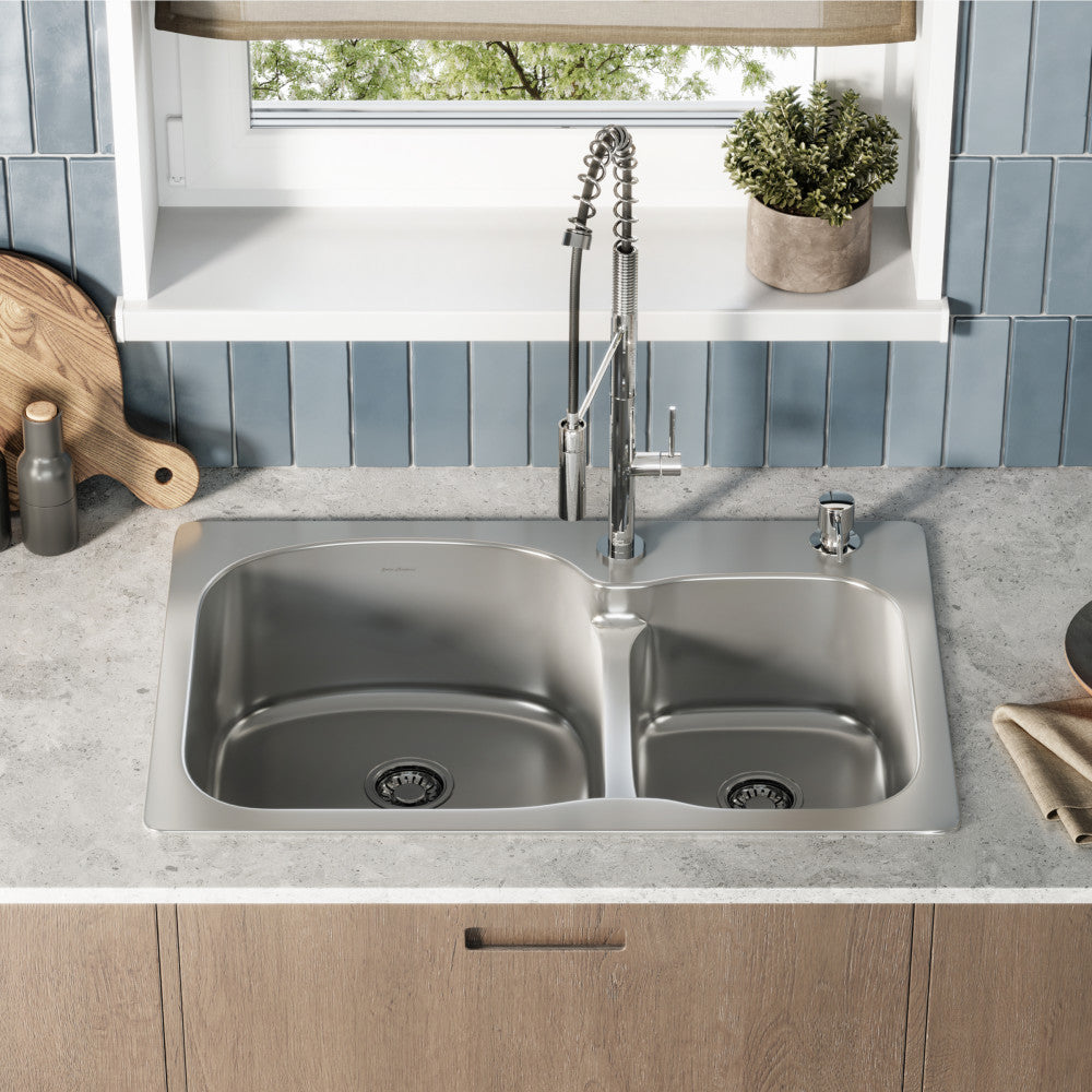 33 x 22 stainless steel dual basin top-mount kitchen sink with high-arc pull-down faucet and soap dispenser.