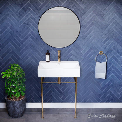 Small white ceramic console sink with gold metal legs and single hole faucet mount.