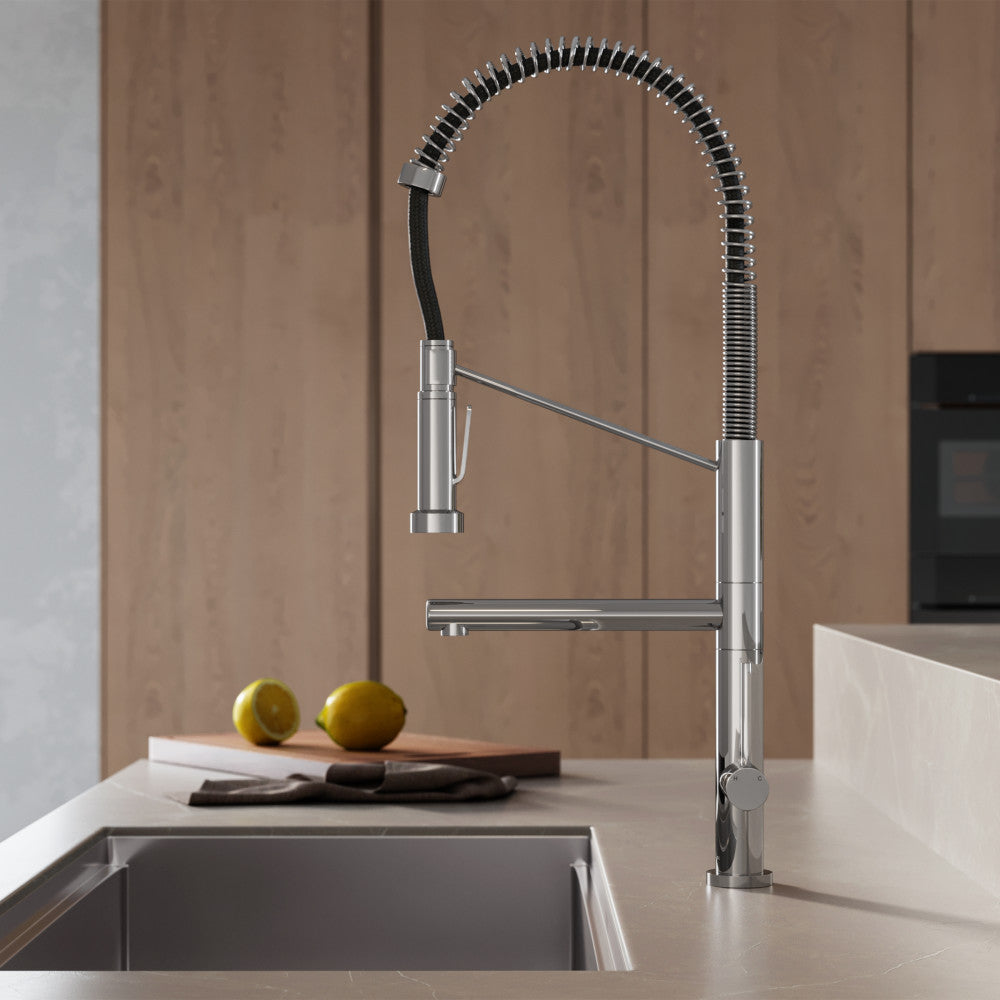 Single handle pull-down kitchen faucet in chrome with pot filler and spring coil spout.