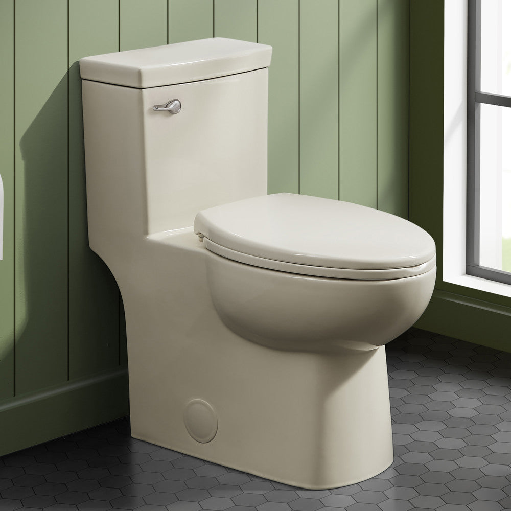 Elongated one-piece toilet in bisque with front flush handle and compact design.