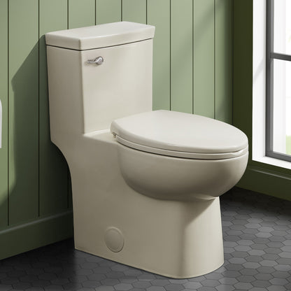 Elongated one-piece toilet in bisque with front flush handle and compact design.