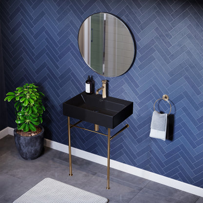Matte black ceramic console sink with gold metal legs, rectangular basin, modern design.