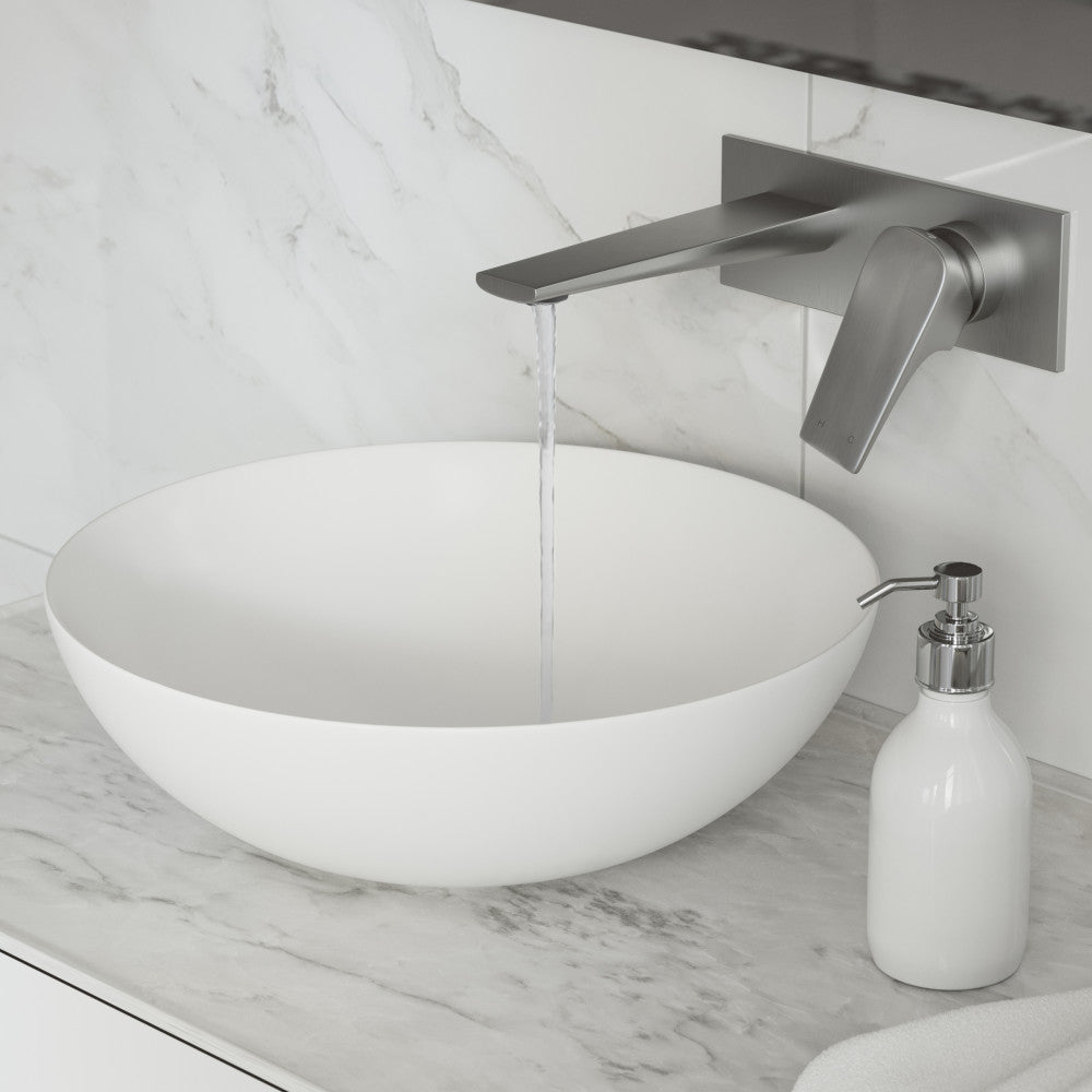 Single-handle wall-mount bathroom faucet in brushed nickel, sleek angled spout with flowing water.