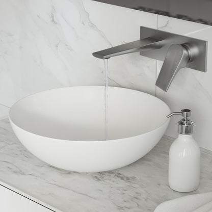 Single-handle wall-mount bathroom faucet in brushed nickel, sleek angled spout with flowing water.