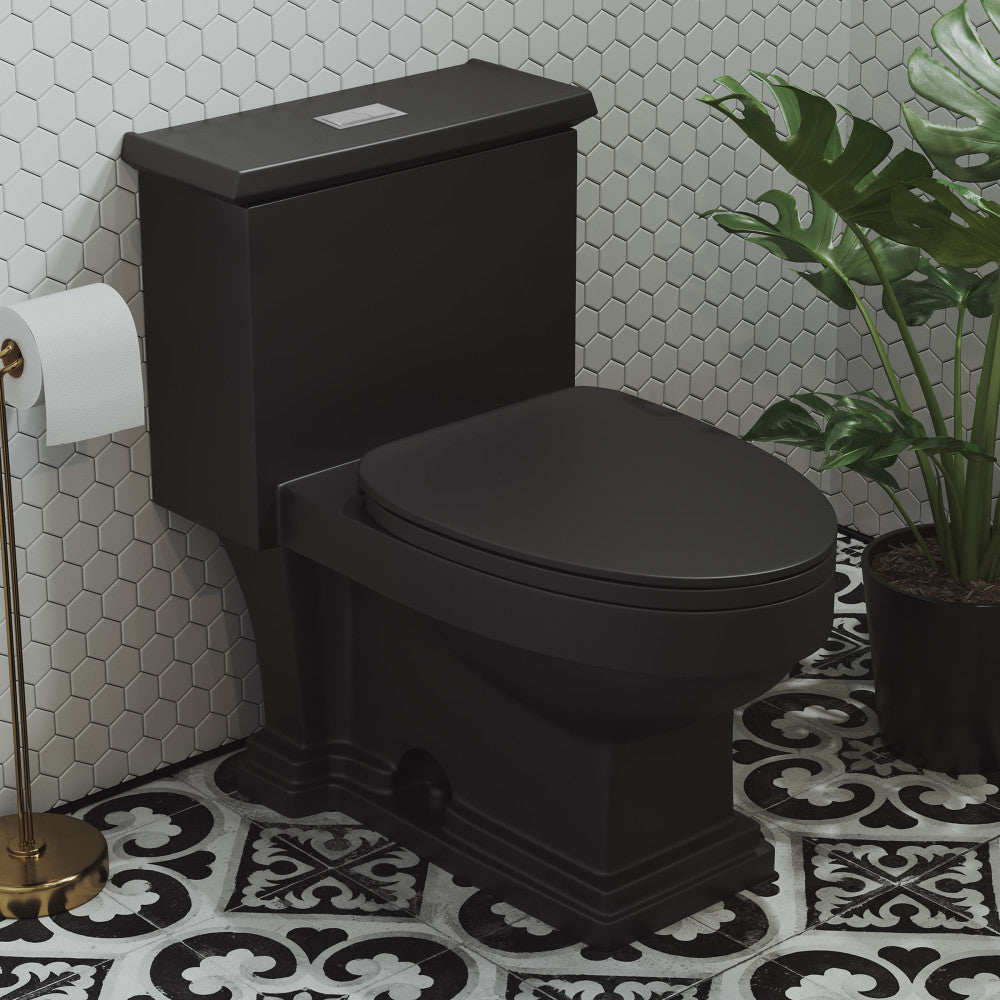 Elongated one-piece matte black toilet with dual flush buttons and soft-close seat on patterned tile floor.