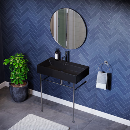 Ceramic console sink in matte black with chrome legs, rectangular basin, wall-mounted design.