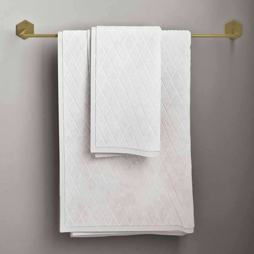 21-inch towel bar in brushed gold with geometric end brackets and white textured towels.