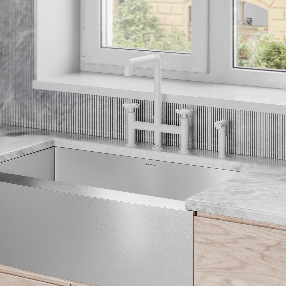 Widespread kitchen faucet with side sprayer in matte white, modern design.