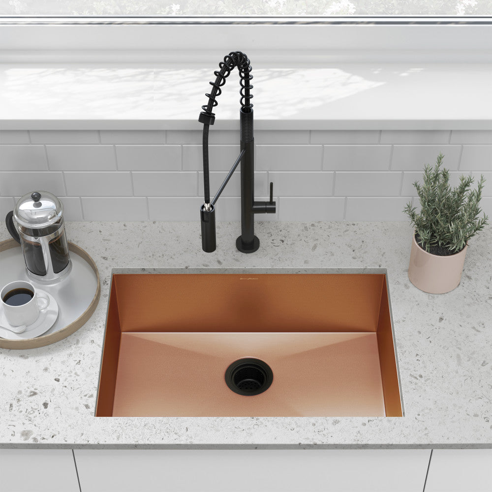 Single basin undermount kitchen sink 26x18 in rose gold stainless steel with matte black faucet.